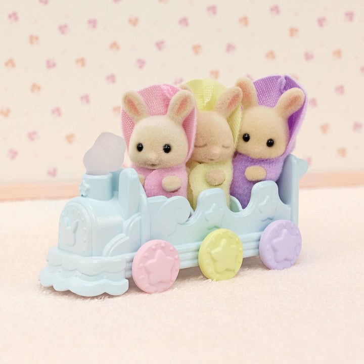 Milk rabbit triplets in choo choo train