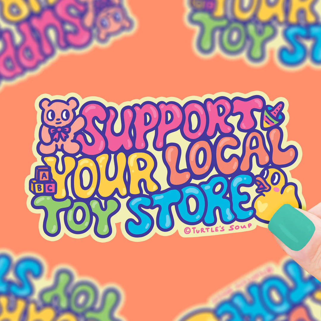 toys surrounding the words support your local toy store on a vinyl sticker