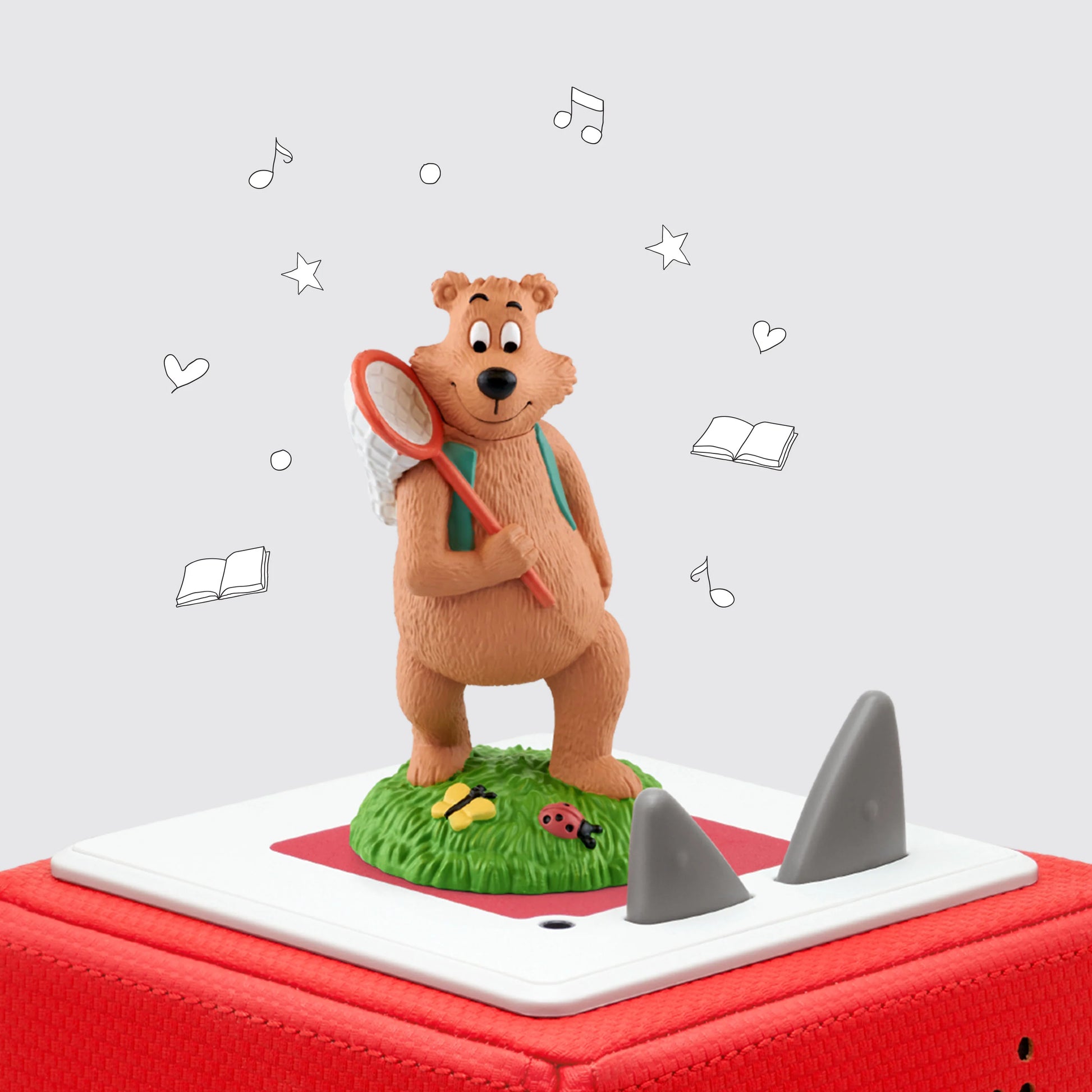 Tonie of Bear with butterfly net standing on a green patch of grass  known as the 7 habits of happy kids on top of toniebox