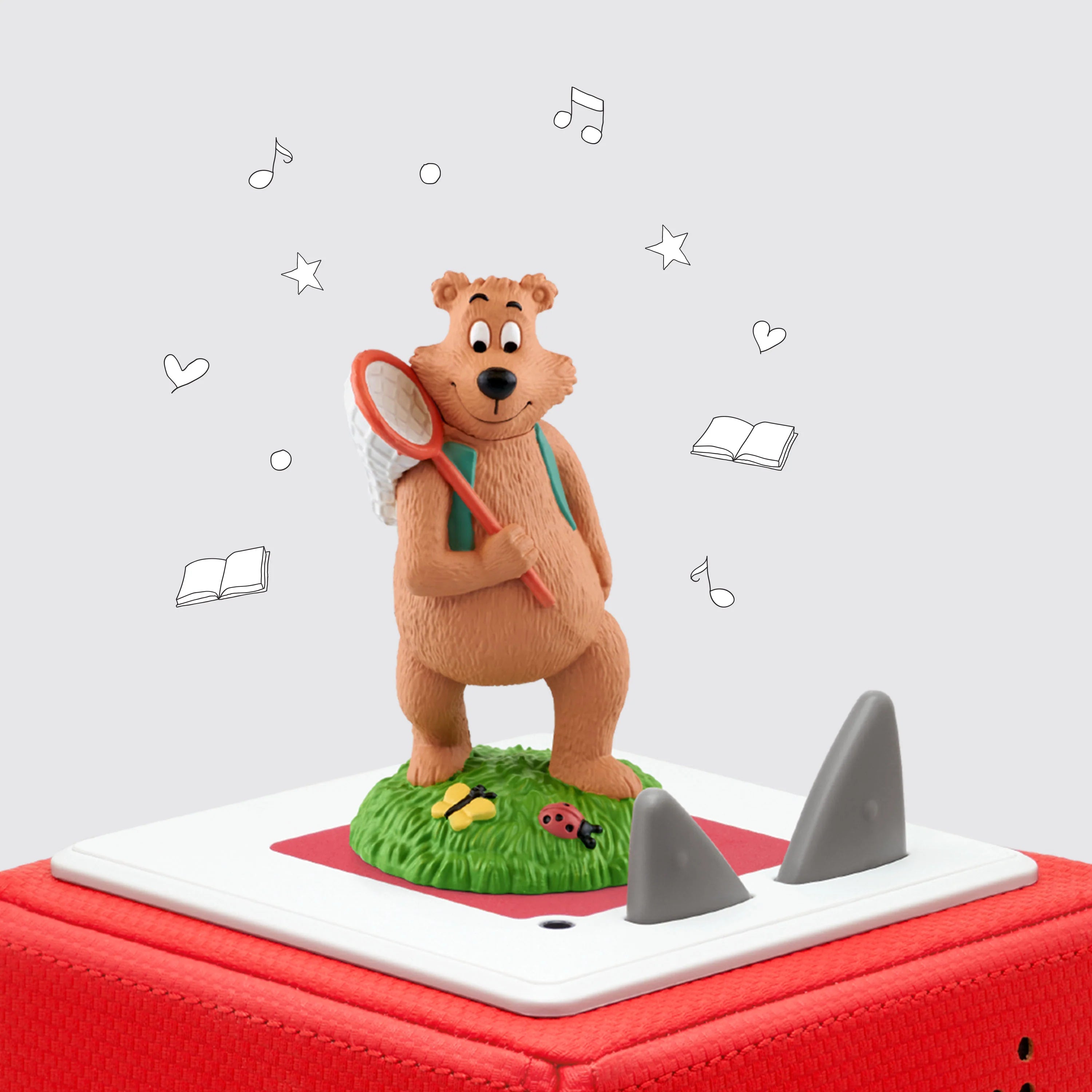 Tonie of Bear with butterfly net standing on a green patch of grass  known as the 7 habits of happy kids on top of toniebox