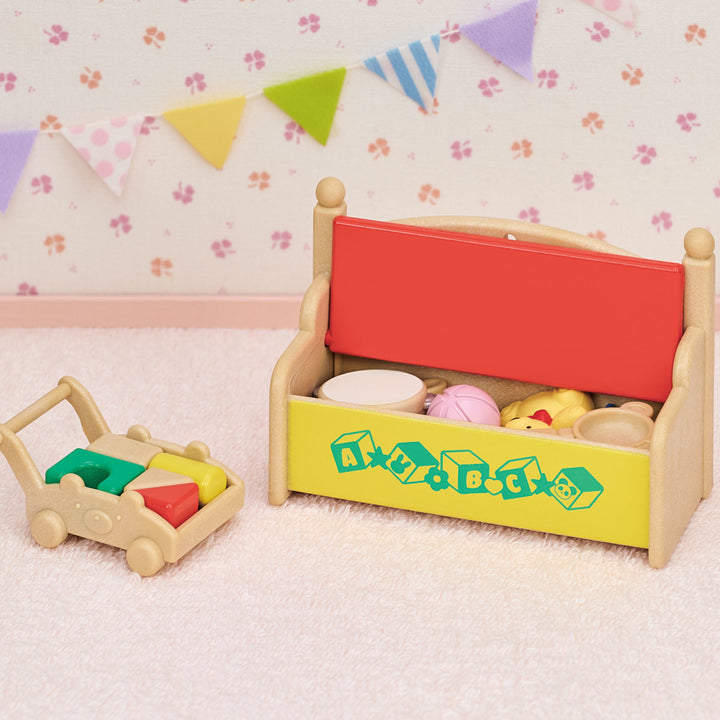 open toy box and push toy with blocks in it