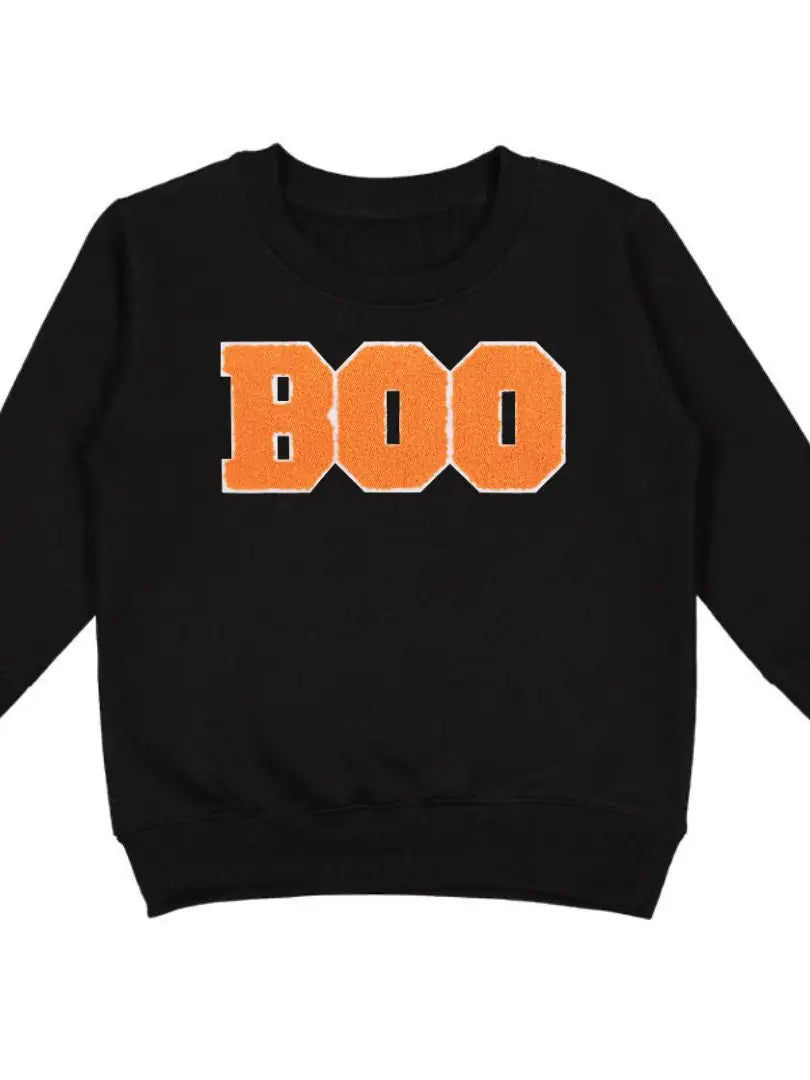 Black sweatshirt with embroidered orange letters spelling out BOO