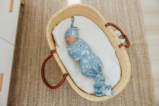 image of baby in knit blanket with matching hat