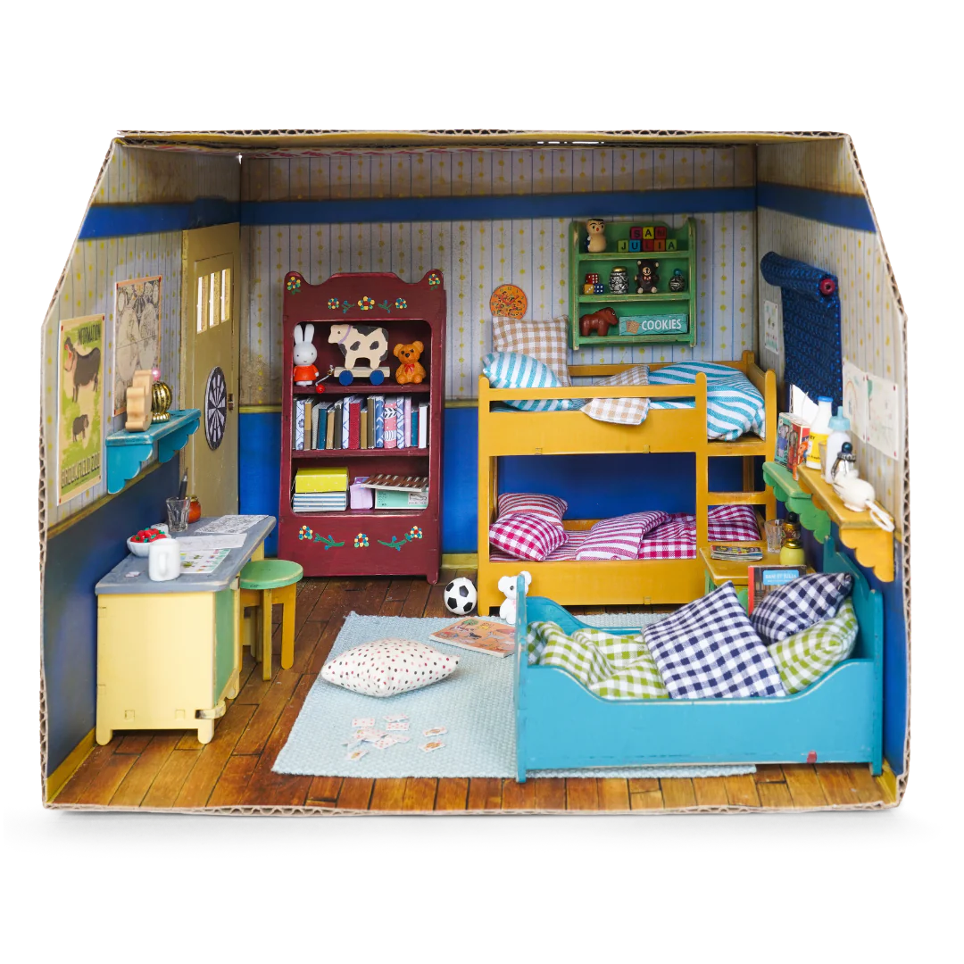 cardboard kids bedroom filled with furniture