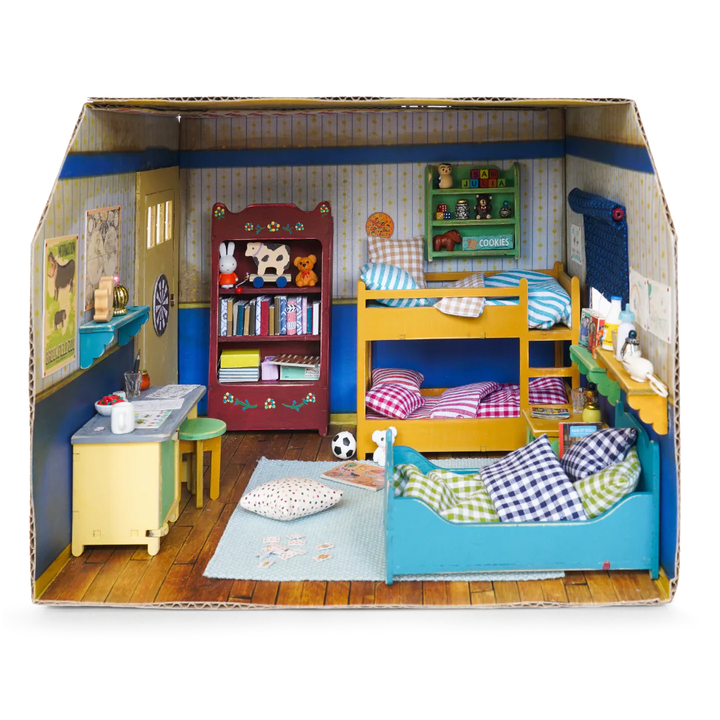 cardboard kids bedroom filled with furniture