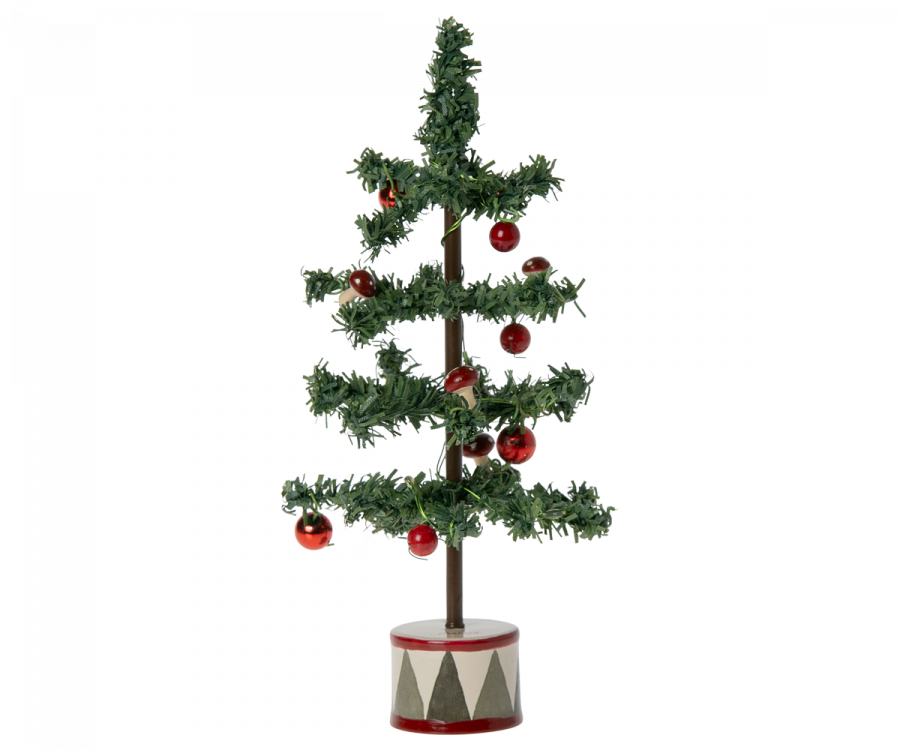 Green Christmas tree with red ball ornaments on a green, cream and red banded circle stand