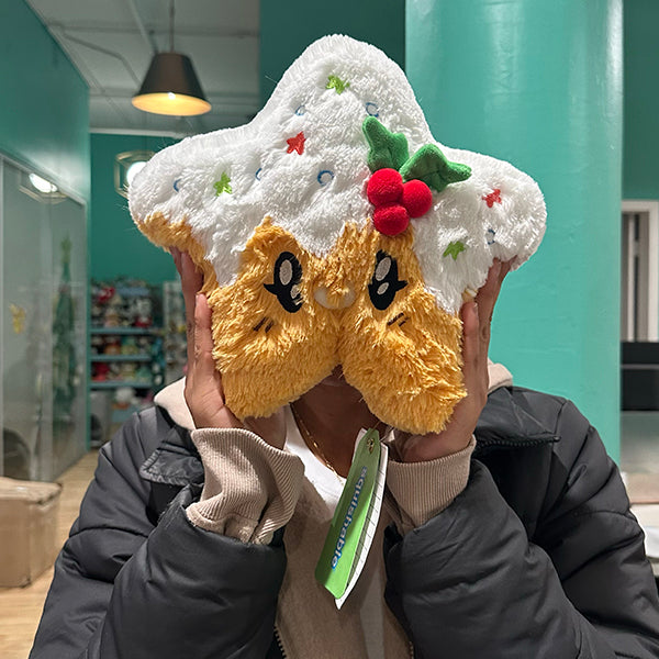 person holding christmas cookie