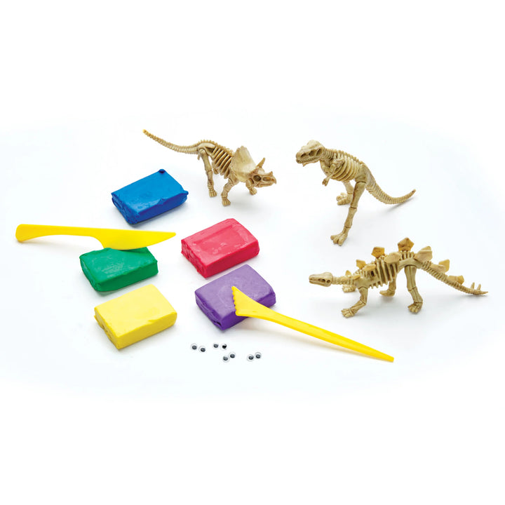 clay and dinosaur skeleton figurines included in kit