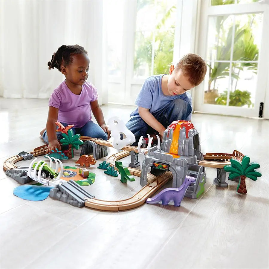 kids playing with dinosaur train set