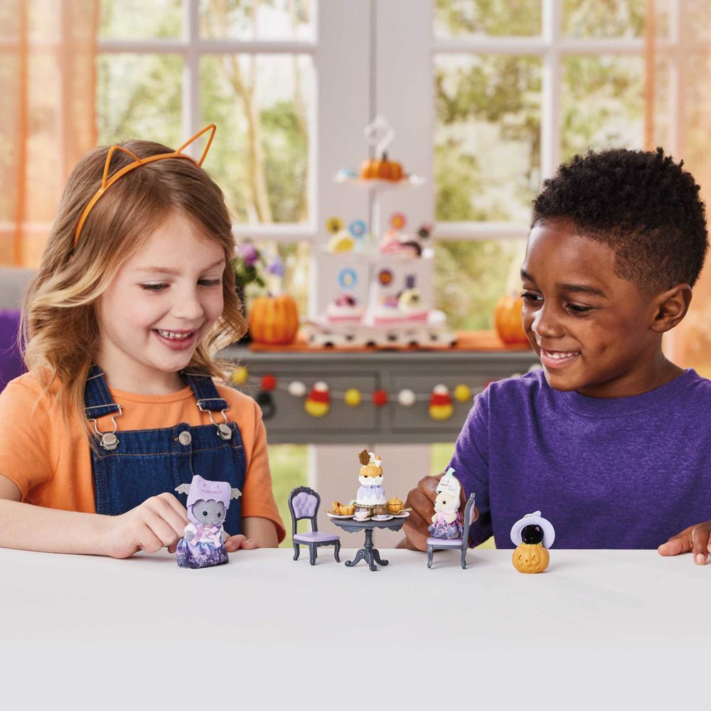 kids playing with halloween set