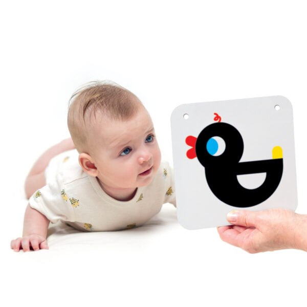 infant on tummy smiling at baby card