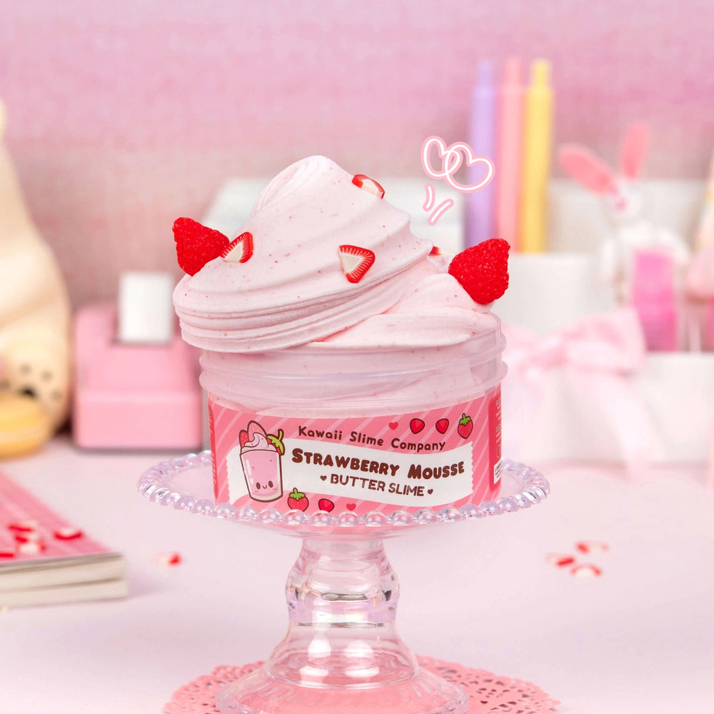 strawberry mousse slime fluffed and partially out of packaging with charms 