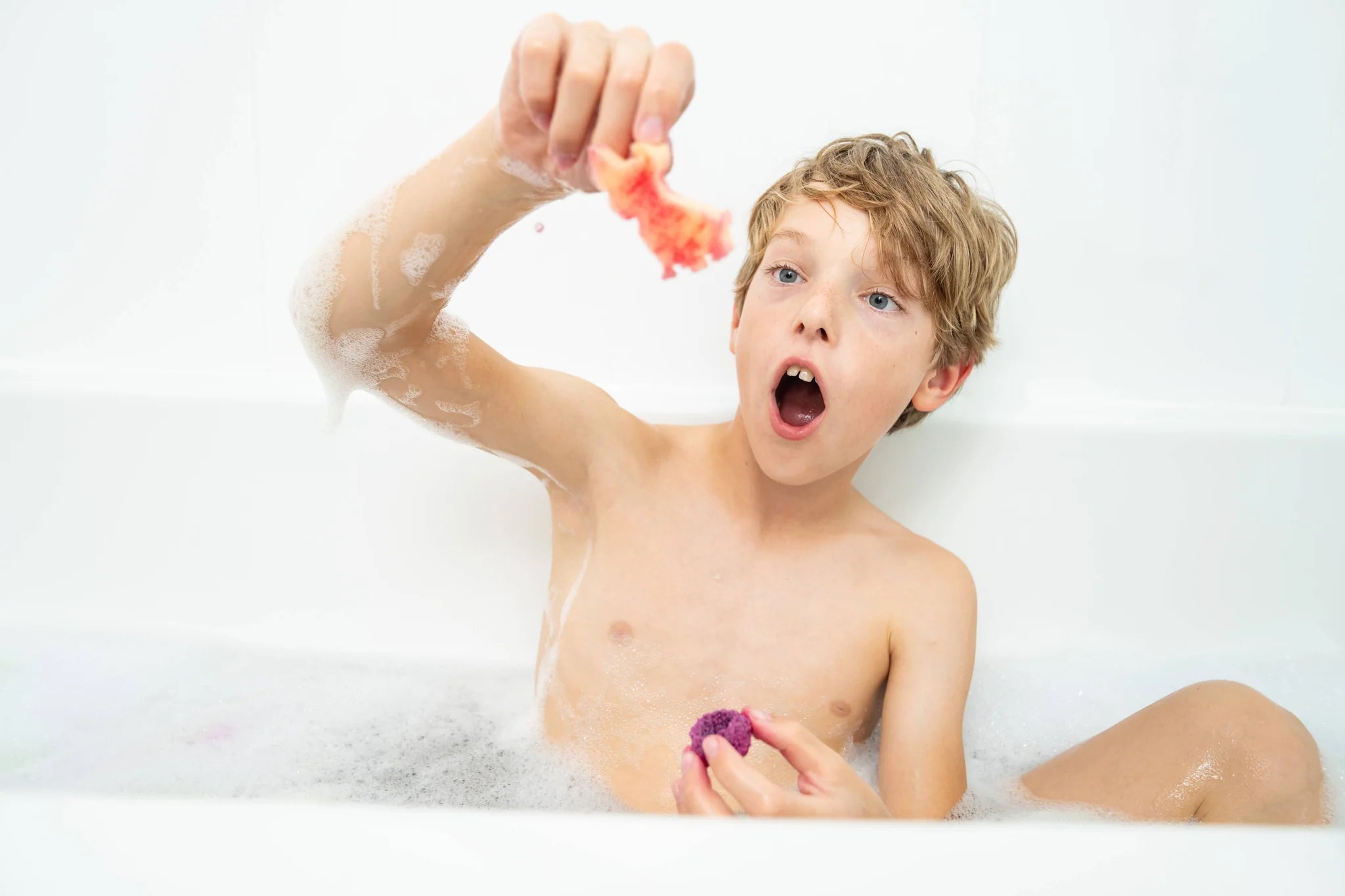 kid with purple fizzy and surprise toy
