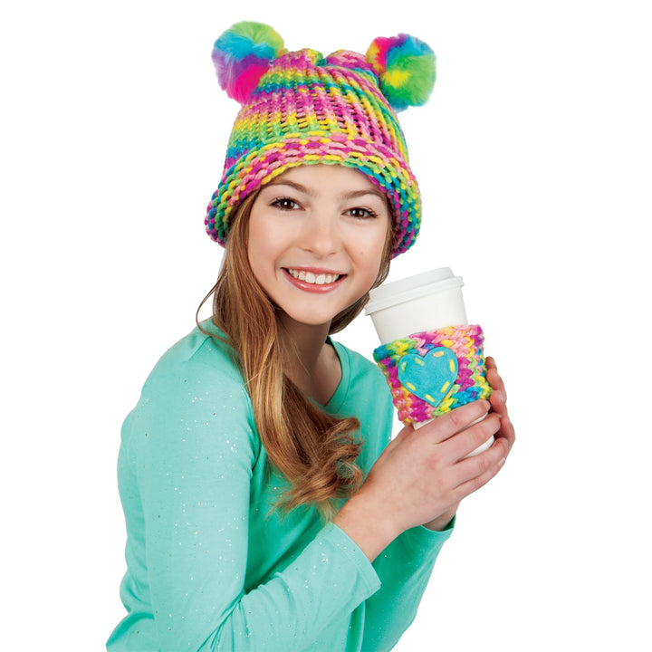 girl modeling hat and coffee holder made with quick knit loom kit