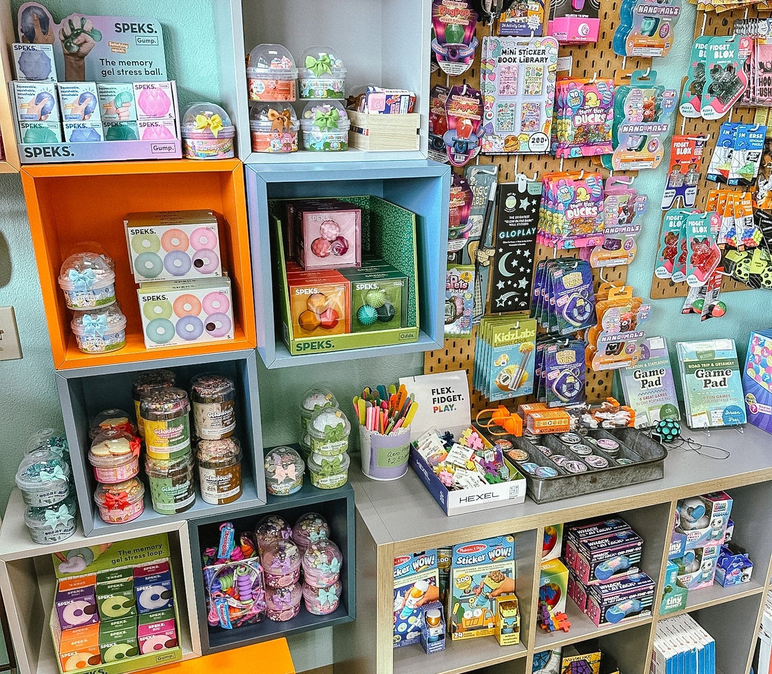 shelves full of toys, fidgets, slime, and fun