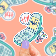 flip phone with ttyl and charm in form of vinyl sticker