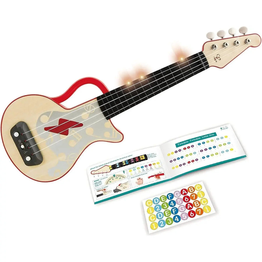 view of ukulele instruction book and stickers