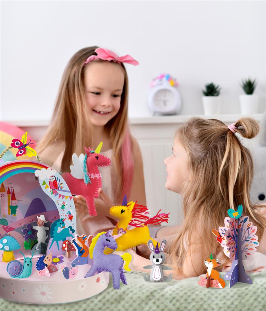 two little girls playing with unicorn craft play box