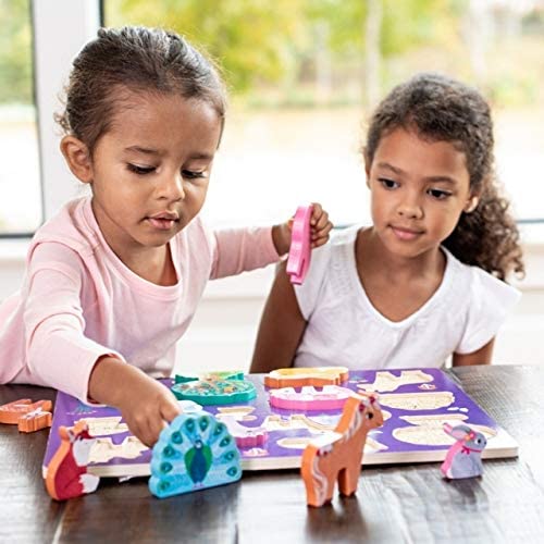 two girls playing with puzzle pieces using creative play