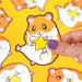 ultra cute hamster holding a star vinyl sticker