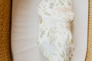 baby swaddled in blanket