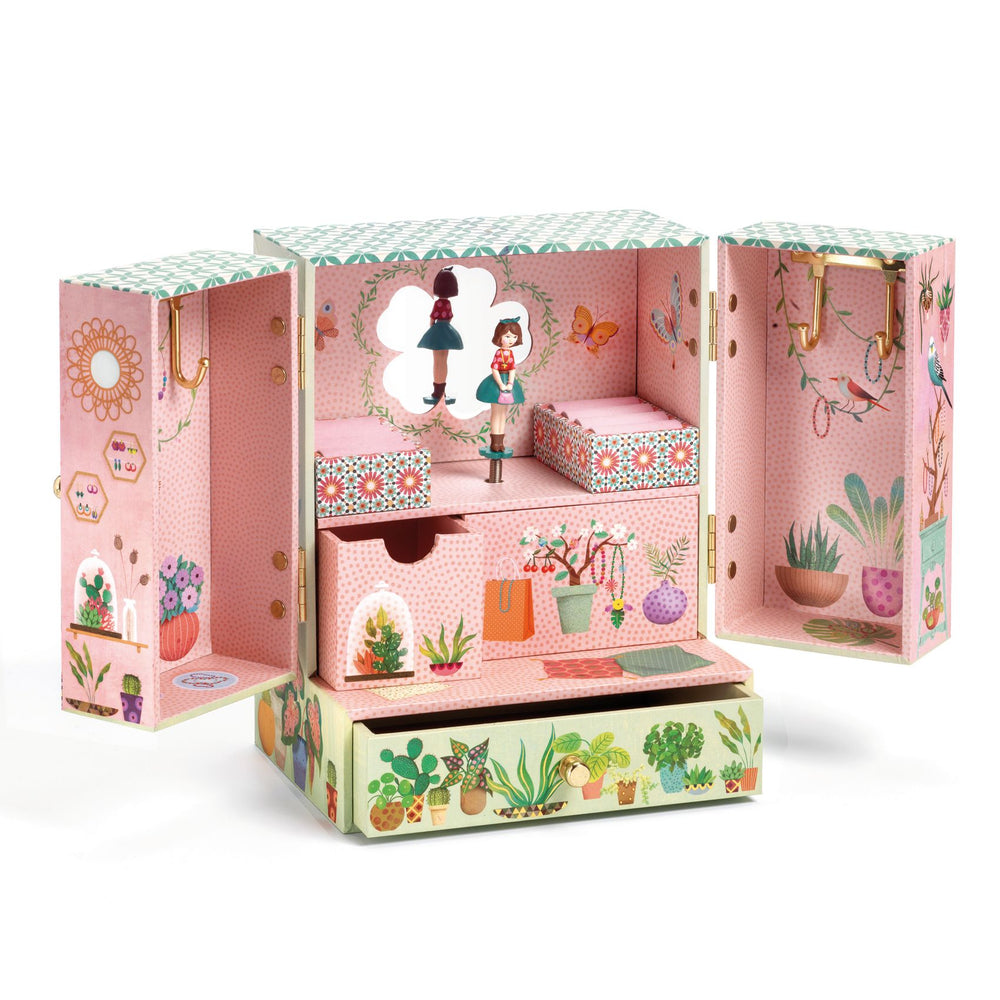 inside of jewelry box showing musical figurine and drawers and hooks