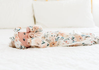 baby wearing knotted gown and matching bow
