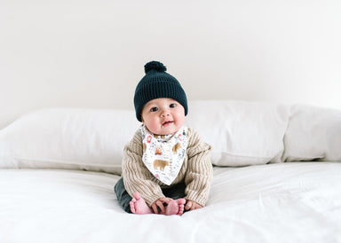 baby shown wearing the wildlife bib