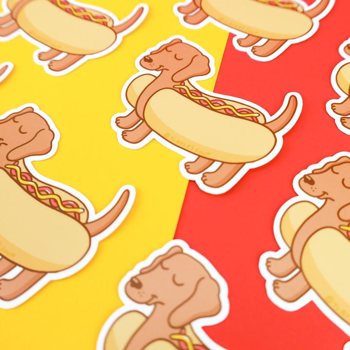 scattered hot dog dachushund puppy dog vinyl stickers on yellow and red background