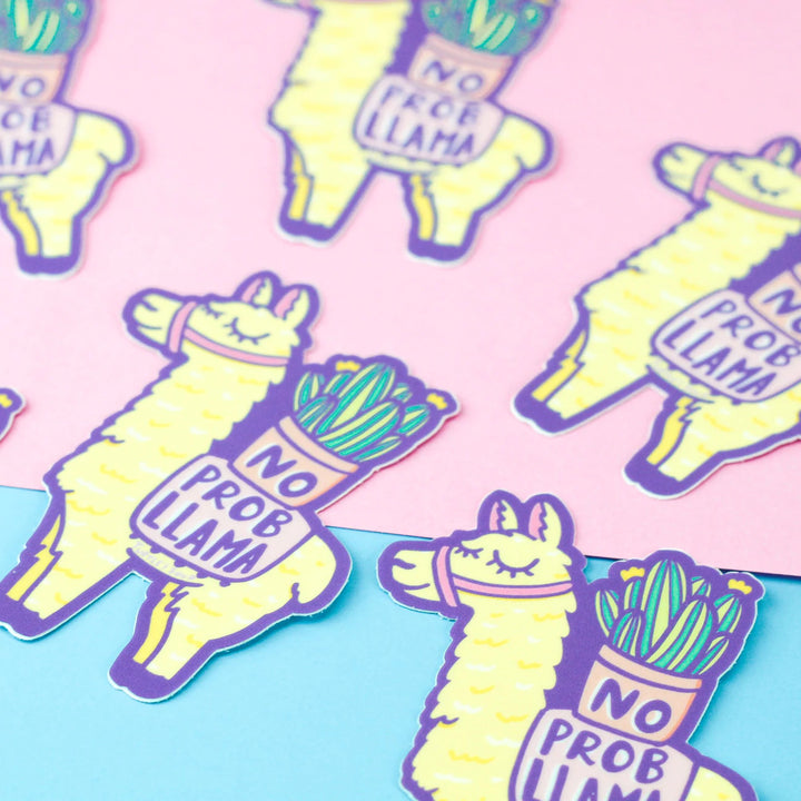 scattered llamas holding plants on back with the words no prob-llama vinyl stickers