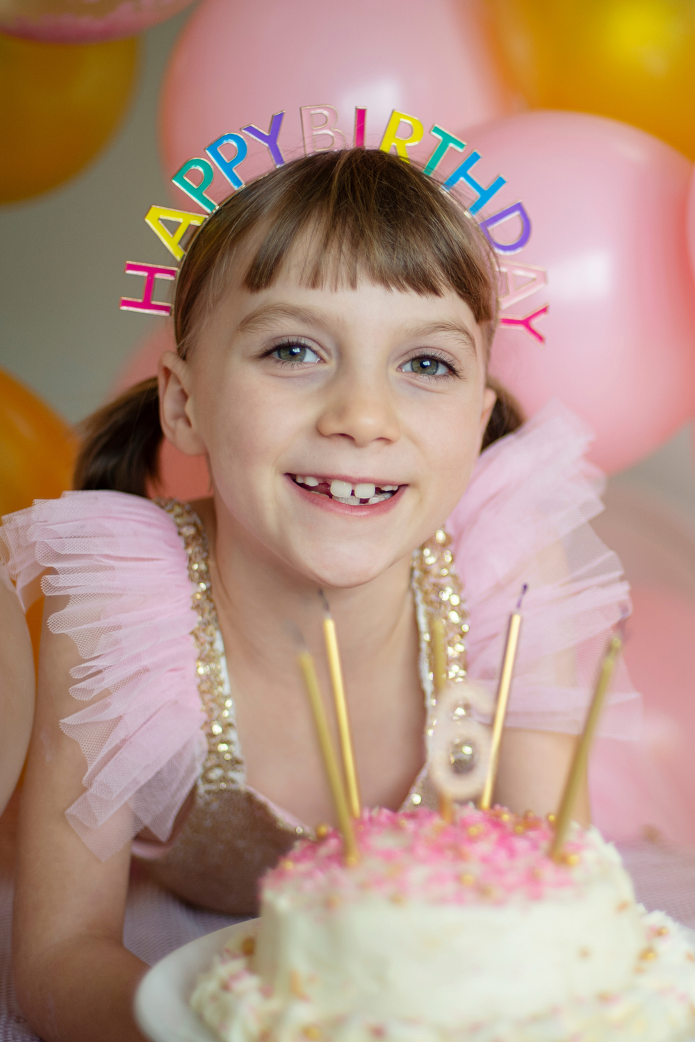 child wearing headband at birthday celebratiom