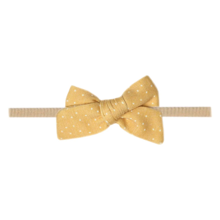 yellow bow with white dots