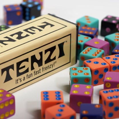 close up of Tenzi packaging with colorful di surrounding